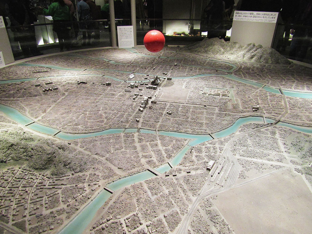 A scale model of Hiroshima showing the size of the fireball created by the atomic bomb and complete destruction of the surrounding area.