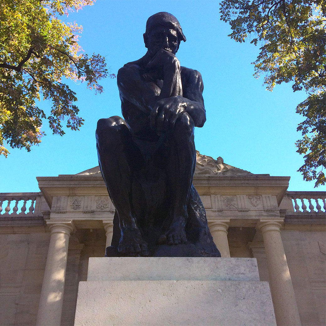 The Thinker sits outside Philadelphia's Rodin Museum. Casts of the statue exist around the world today. We saw the original two-foot tall version in Musee Rodin in Paris during our travels around Europe.